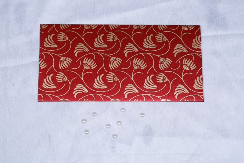 Front view of Shagun Envelope with Waving Flower Theme in Royal Red
