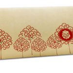 Front view of Ganesha Shagun Envelope on Bright Beige and Red Trees