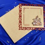 Radha Krishna Laser Cut Wedding Card in Golden Red