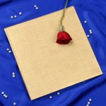 Envelope of Radha Krishna Laser Cut Wedding Card in Golden Red