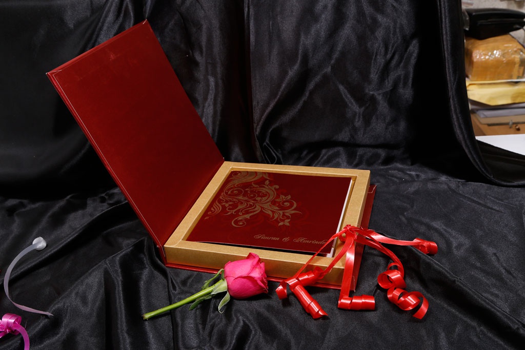 box wedding card in red with golden floral pattern